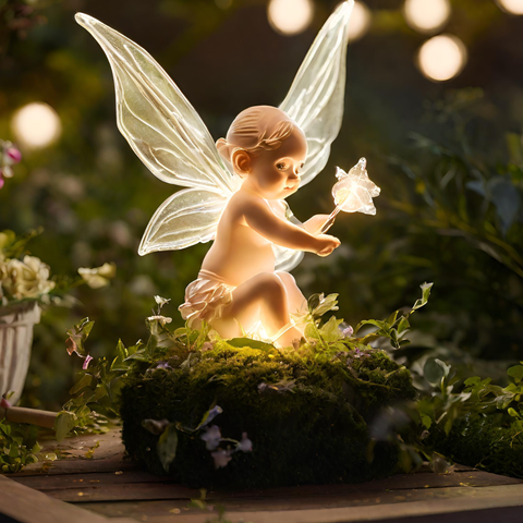 Ambient-lit sculpture featuring a charming fairy baby placed among garden foliage, enhancing the outdoor ambiance with enchanting illumination, epitomizing the finest in outdoor landscape lighting design.