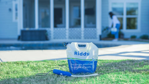 Riddy Pest Control in front of a home.