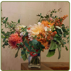dahlia, eucalyptus bouquet in glass vase