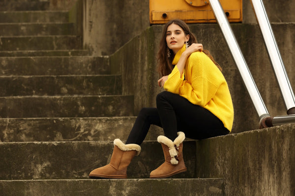 UGG Premium 2 Button Shark Sheepskin Boots in Chestnut colour, being modeled by a female sitting on steps.