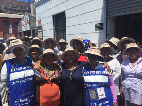 Big Issue Vendors wearing their new Sunhats