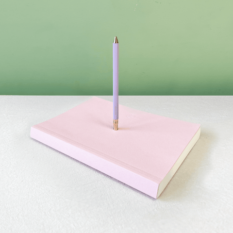 Pink notebook and pen
