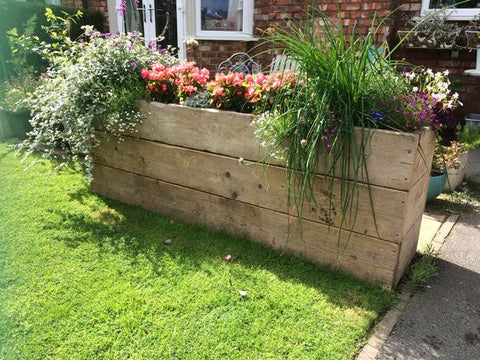 old scaffold boards used as planters