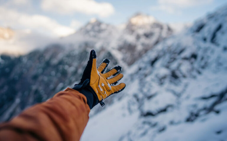 Hand winter sport glove on snow