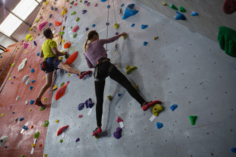 athletes rock climbing