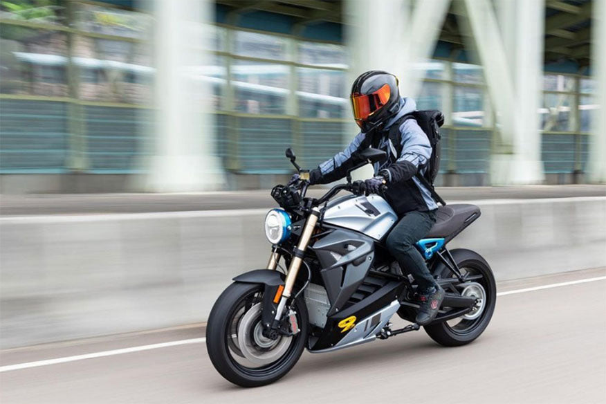 biker in motion on road