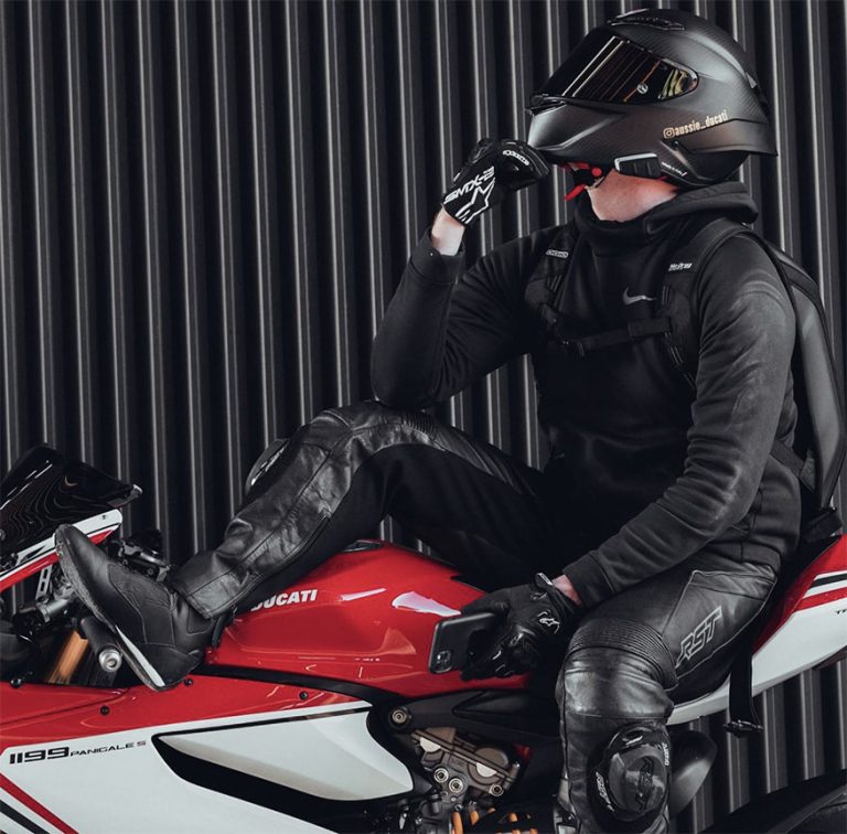 biker posing on motorcycle