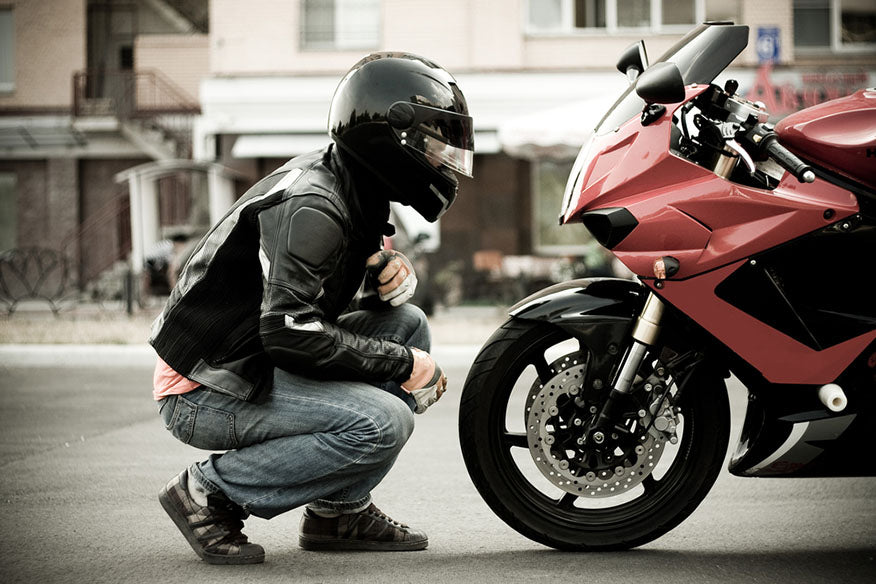 motorcyclist in helmet leather jacket