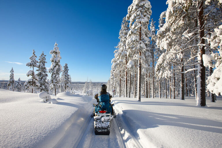 traveling Finnish Lapland with snowmobile