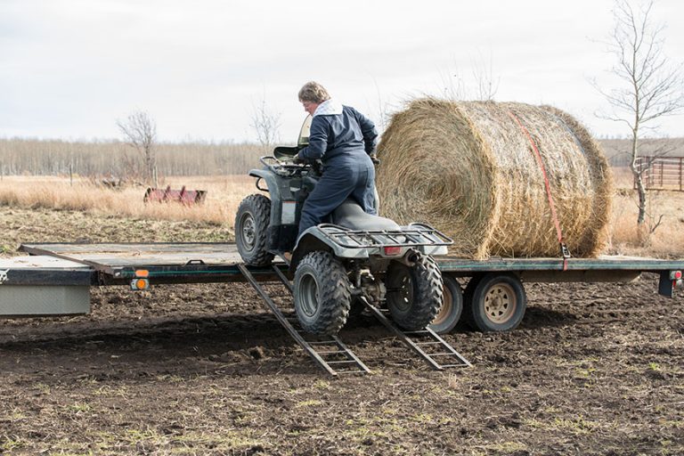 woman on a quad backing down a ramp