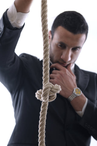 A bondage mentor inspecting a knot.