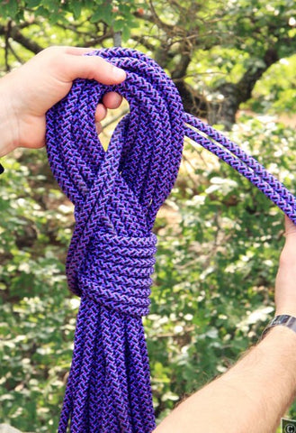 Coiled purple bondage rope.