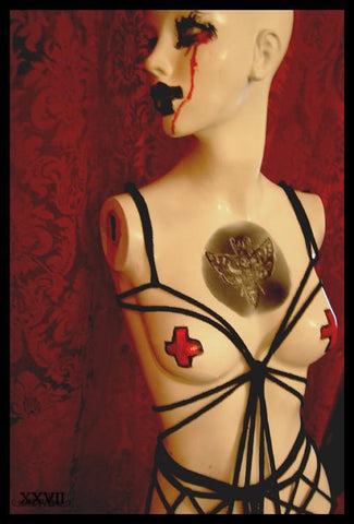 Mannequin being used to practice a bondage harness.