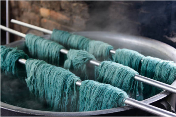 Dying wool for hand knotted rugs in Nepal