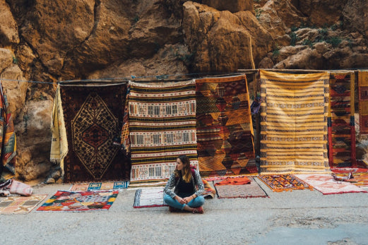 Moroccan rugs displayed on road side