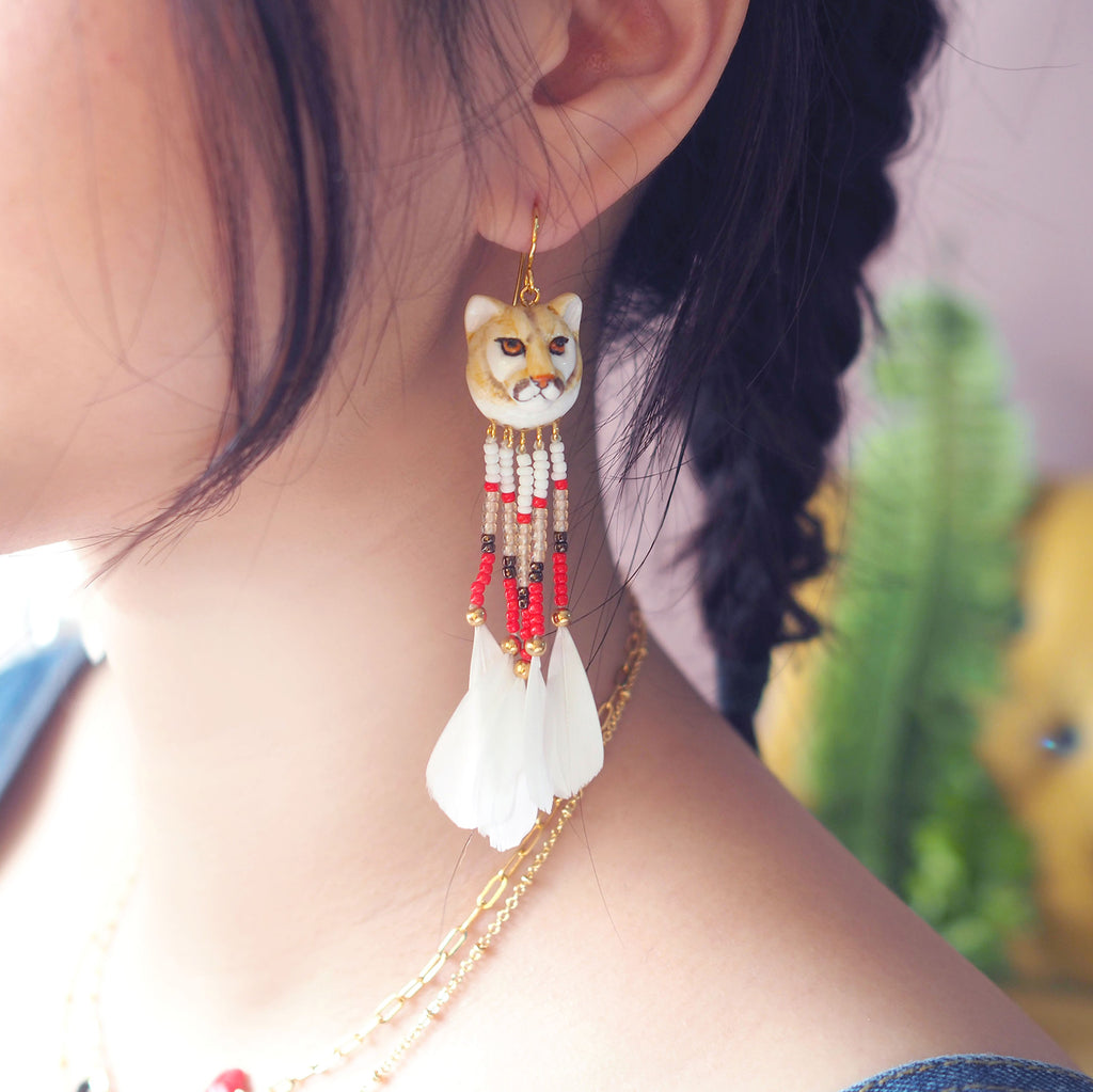 gold puma earrings
