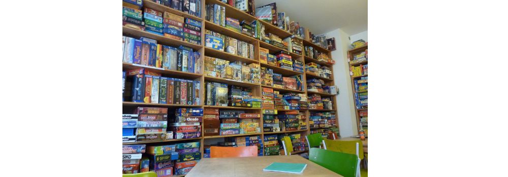 Book case collection displayed in a game room on shelves