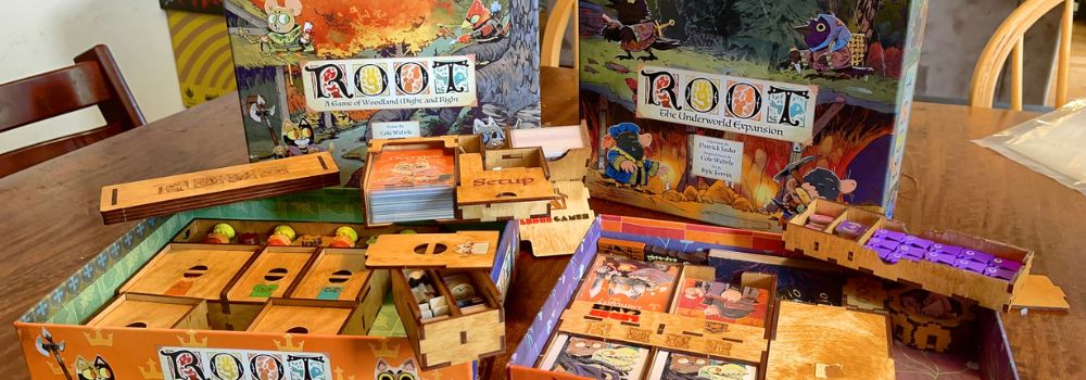 The Root board game setup with inserts