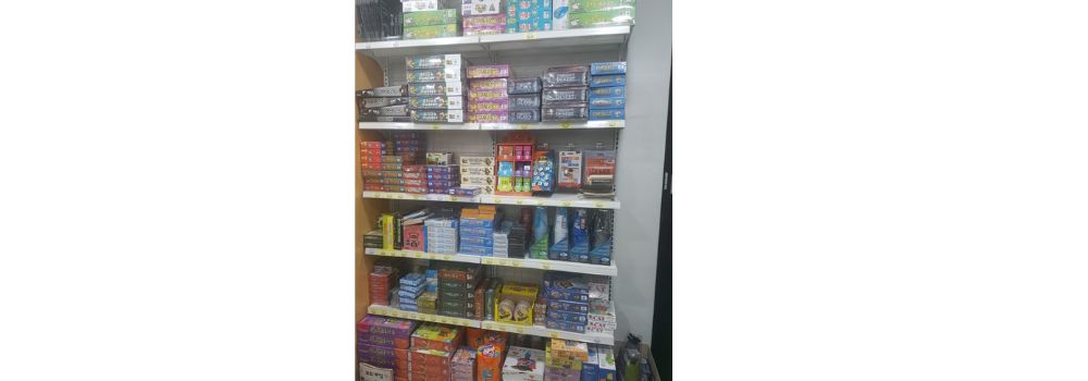 board games stacked on shelves
