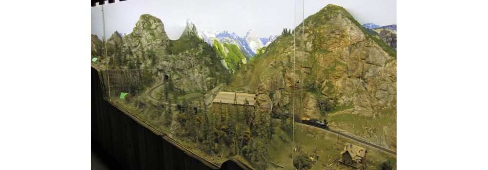 Miniature diorama with train traveling across country at Miniature World, Victoria, Canada