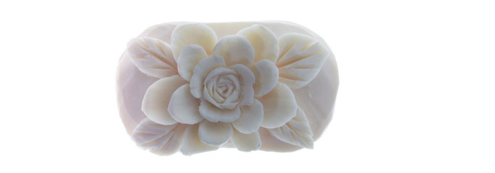 flower art carved into a bar of soap