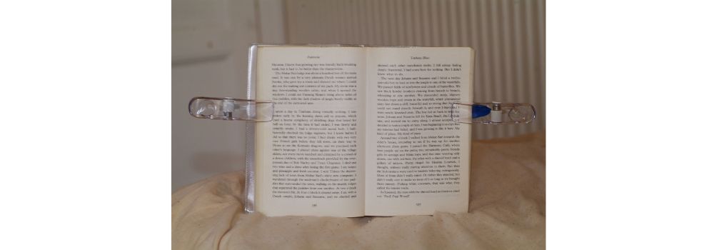 a book with two clips on the edges holding the pages together