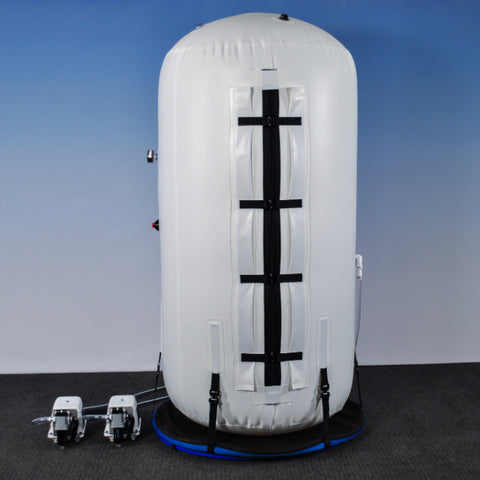 summit to sea vertical dive hyperbaric chamber fully pressurized in a blue room