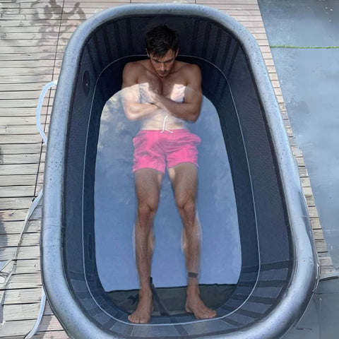 man engaged in cold water therapy using his diy ice bath