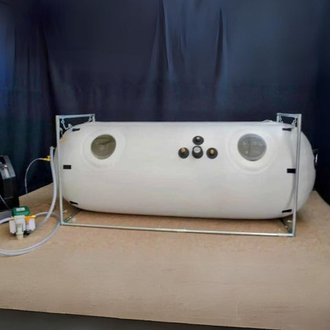potable chamber with oxygen concentrator sits in a blue room