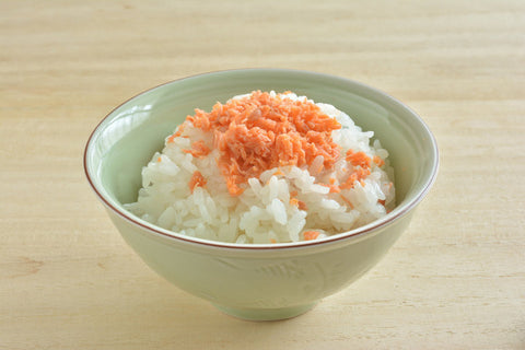 A bowl of rice with plenty of salmon furikake seasoning on top