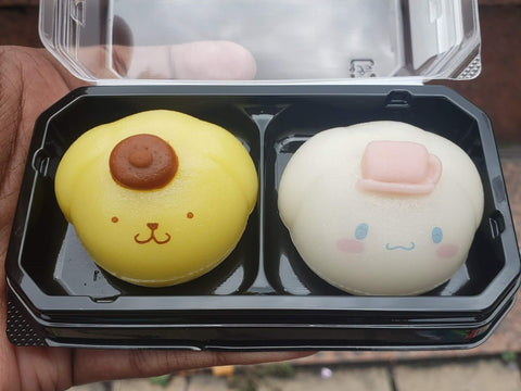Two daifuku in the shape of Sanrio's Cinnamoroll and Pompompurin