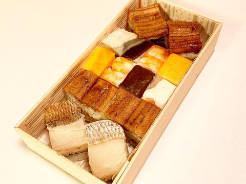 A wooden box of hakozushi without any sauces