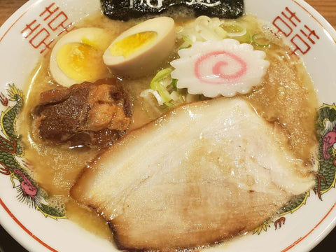 A bowl of ramen with chashu pork, egg and more from a Dotonbori shop