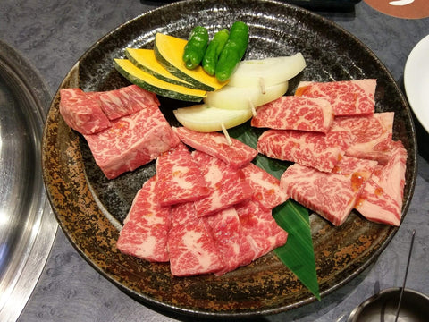 A plate of raw meat and vegetables from Himi for yakiniku