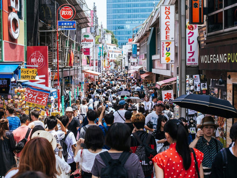 Many people walk through the packed Takeshita Street in Harajuku