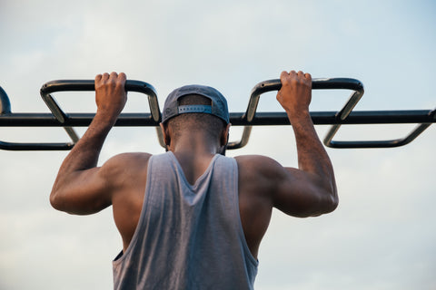 Man exercising with his back toward the camera