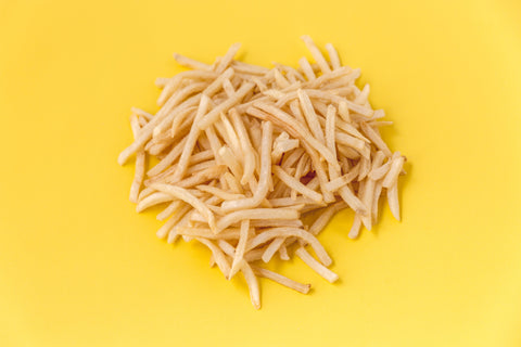 French fries on a yellow background
