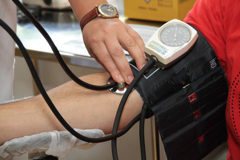 Person measuring blood pressure