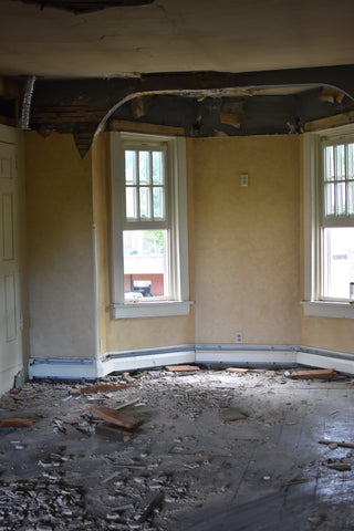 Second floor dining room demo exposes 1849 arch over bay windows.