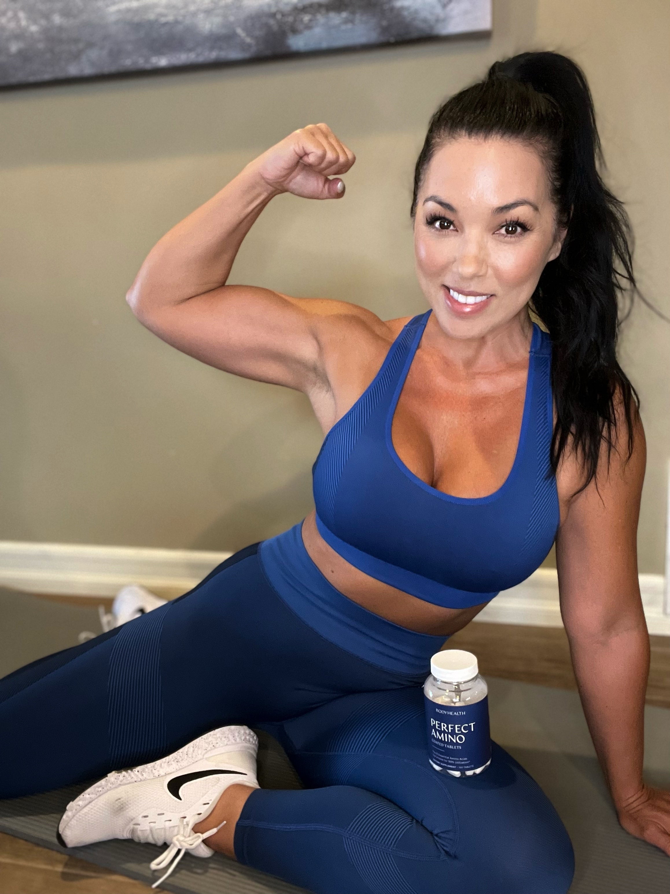 BodyHealth Woman Influencer Drinking PerfectAminoXP at the gym for a lean toned body