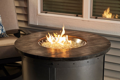 Take in the warm, mesmerizing feel of the glowing fire as you relax or entertain guests with the Edison Gas Fire Pit Table. The Crystal Fire® Plus burner is UL listed for safety.