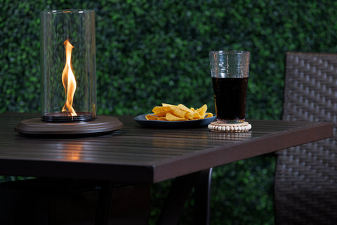 This innovative tabletop fire pit will be the star of your outdoor area! The Intrigue Tabletop Outdoor Lantern is designed to fit on virtually any dining or pub table with an umbrella hole