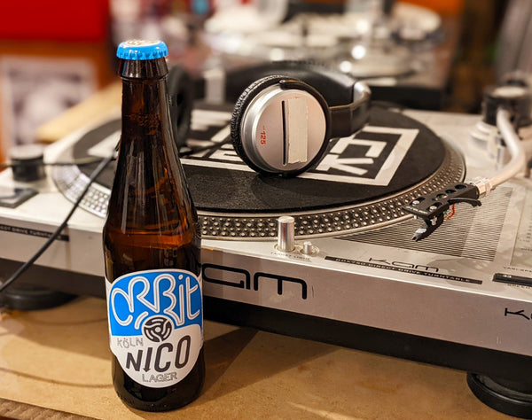 Nico beer bottle and vinyl deck