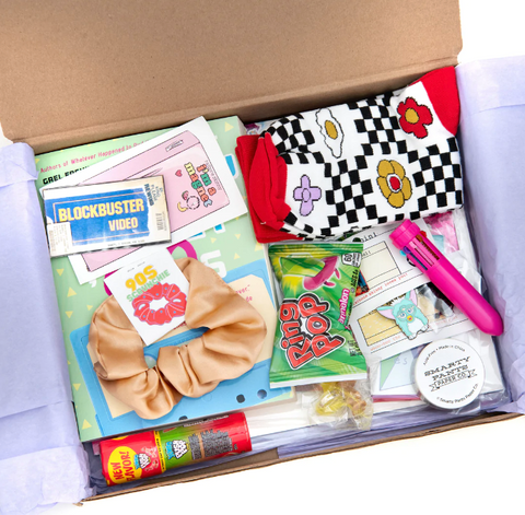 past oddball club box packed with 90s nostalgic items like socks, magnet, scrunchies