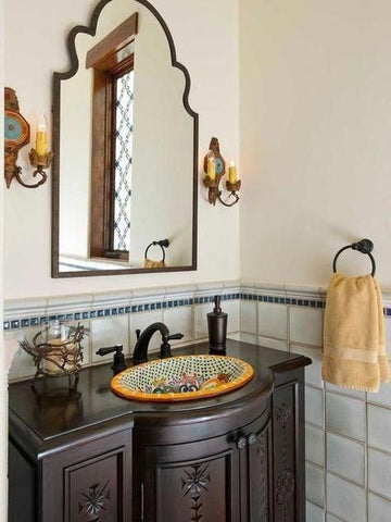 unique hacienda style bathroom with a soaking bathtub