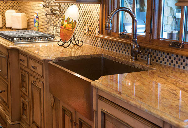 custom copper sink with an apron installed in a kitchen