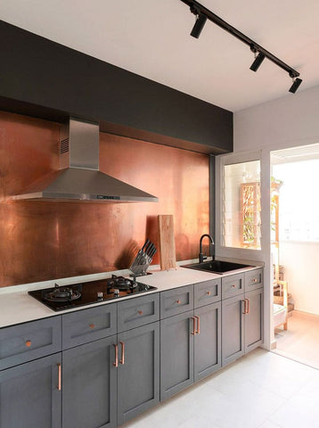custom copper backsplash installed on a kitchen wall