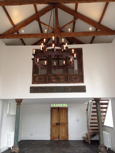 medieval style iron chandelier illuminating a living room