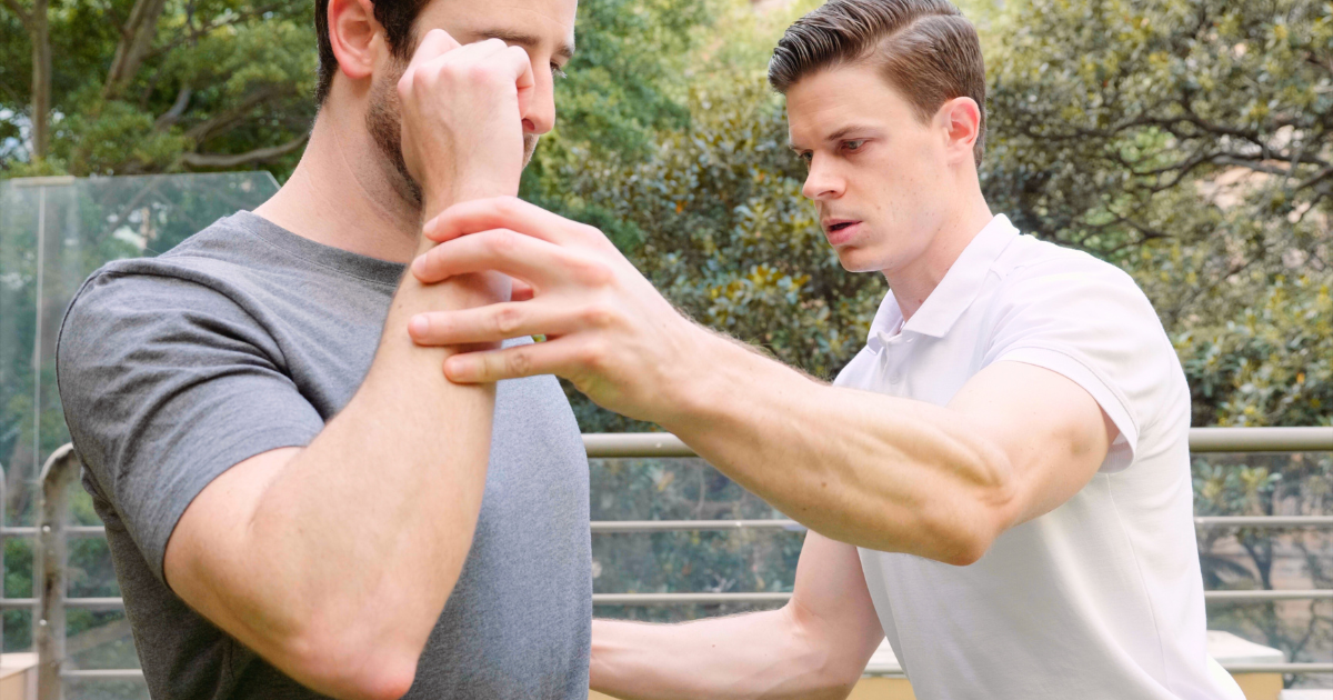 Physiotherapist and nutritionist coach working with male patient.