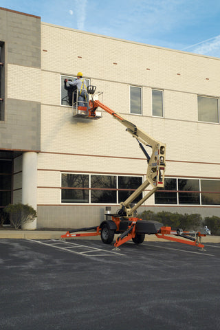 A JLG T350 Washing the windows of a corporate building.